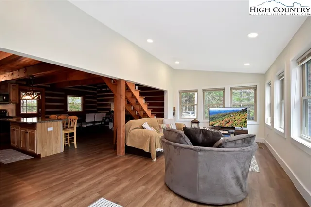 a view of a livingroom with furniture and a fireplace