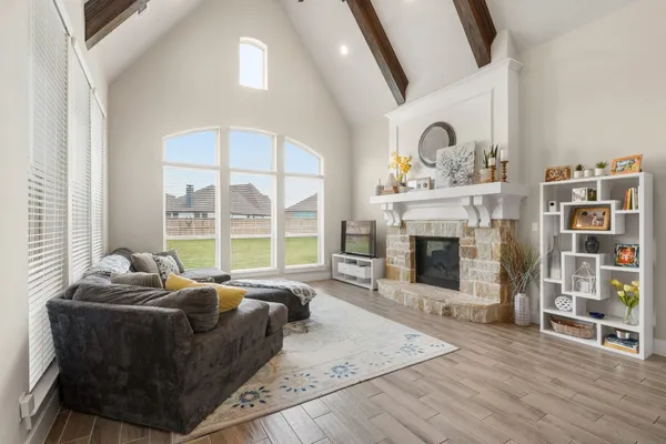a bathroom with a toilet a sink a mirror and a bathtub