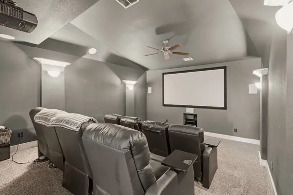 a bathroom with a granite countertop sink a toilet and a mirror