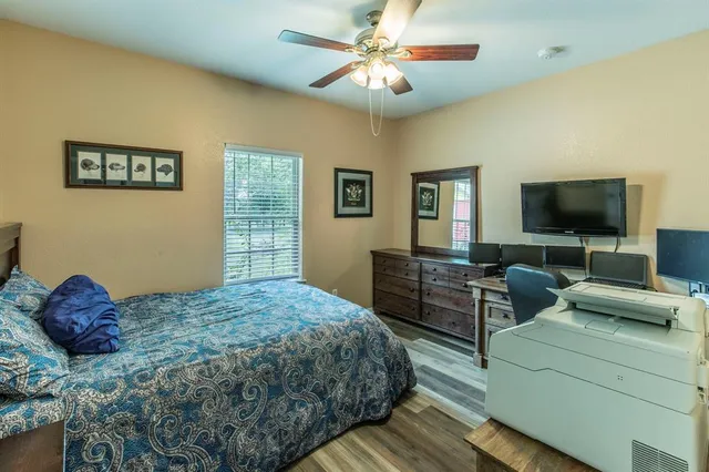 a bedroom that has a bed and a table in it