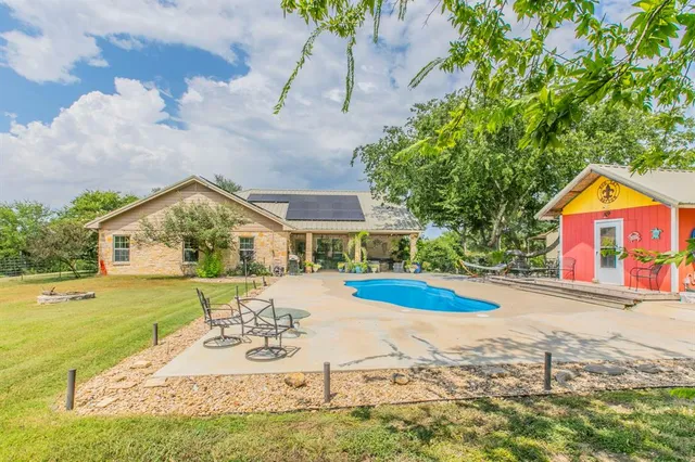 a view of pool with outdoor seating