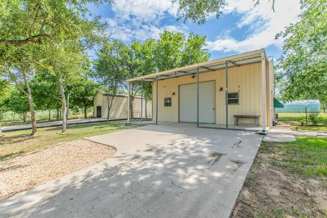 a view of a swimming pool with an outdoor space and seating area