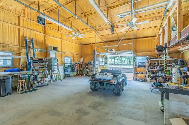 a view of a backyard with large trees