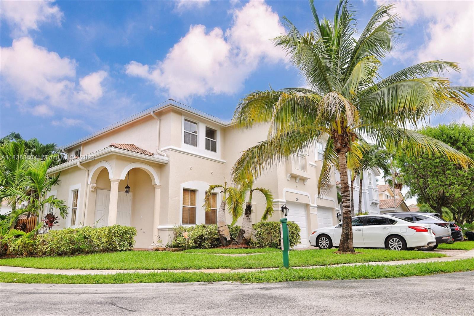 301 Southwest 87th Path Miami, FL 33174 - Photo 1 of 22 a front view of a house with garden and trees