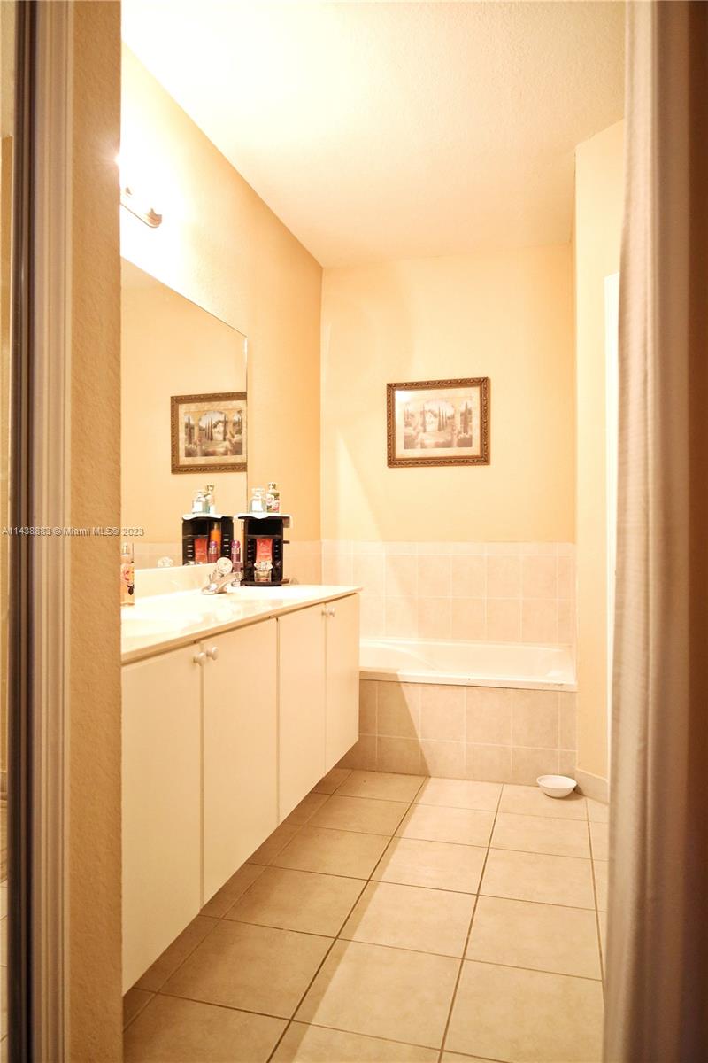 301 Southwest 87th Path Miami, FL 33174 - Photo 15 of 22 a room with a sink and a painting on the wall