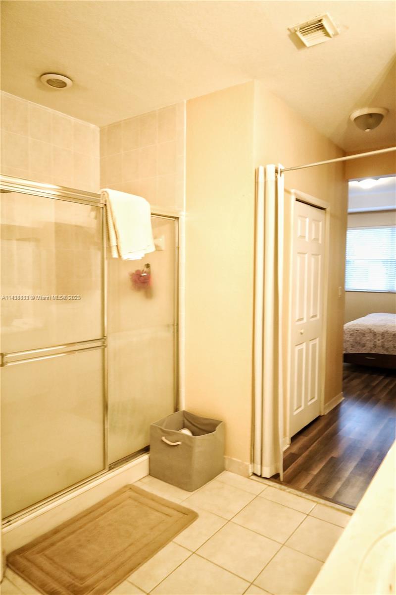 301 Southwest 87th Path Miami, FL 33174 - Photo 16 of 22 a bathroom with a tub and shower