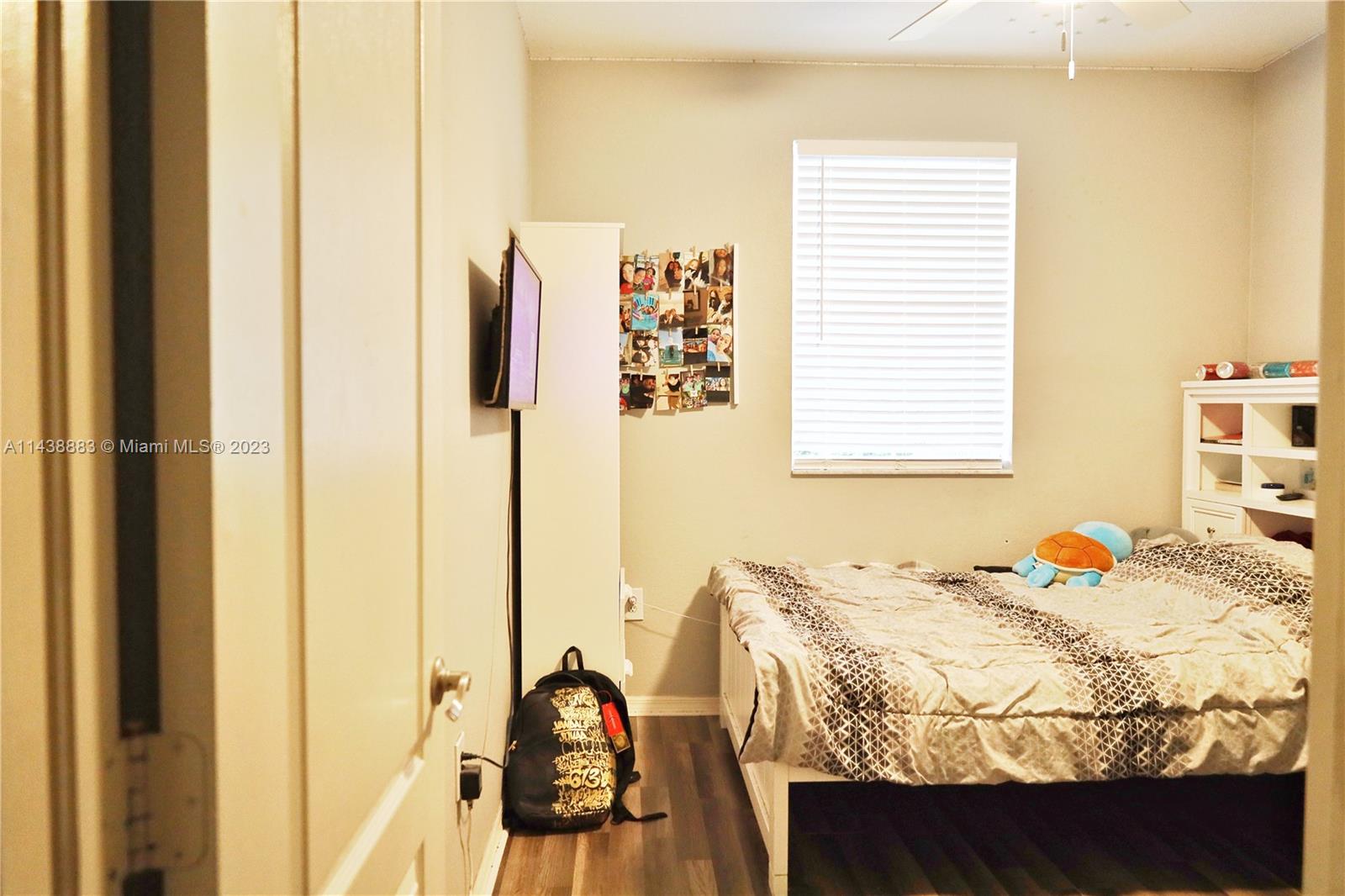 301 Southwest 87th Path Miami, FL 33174 - Photo 18 of 22 a bedroom with a bed and a window