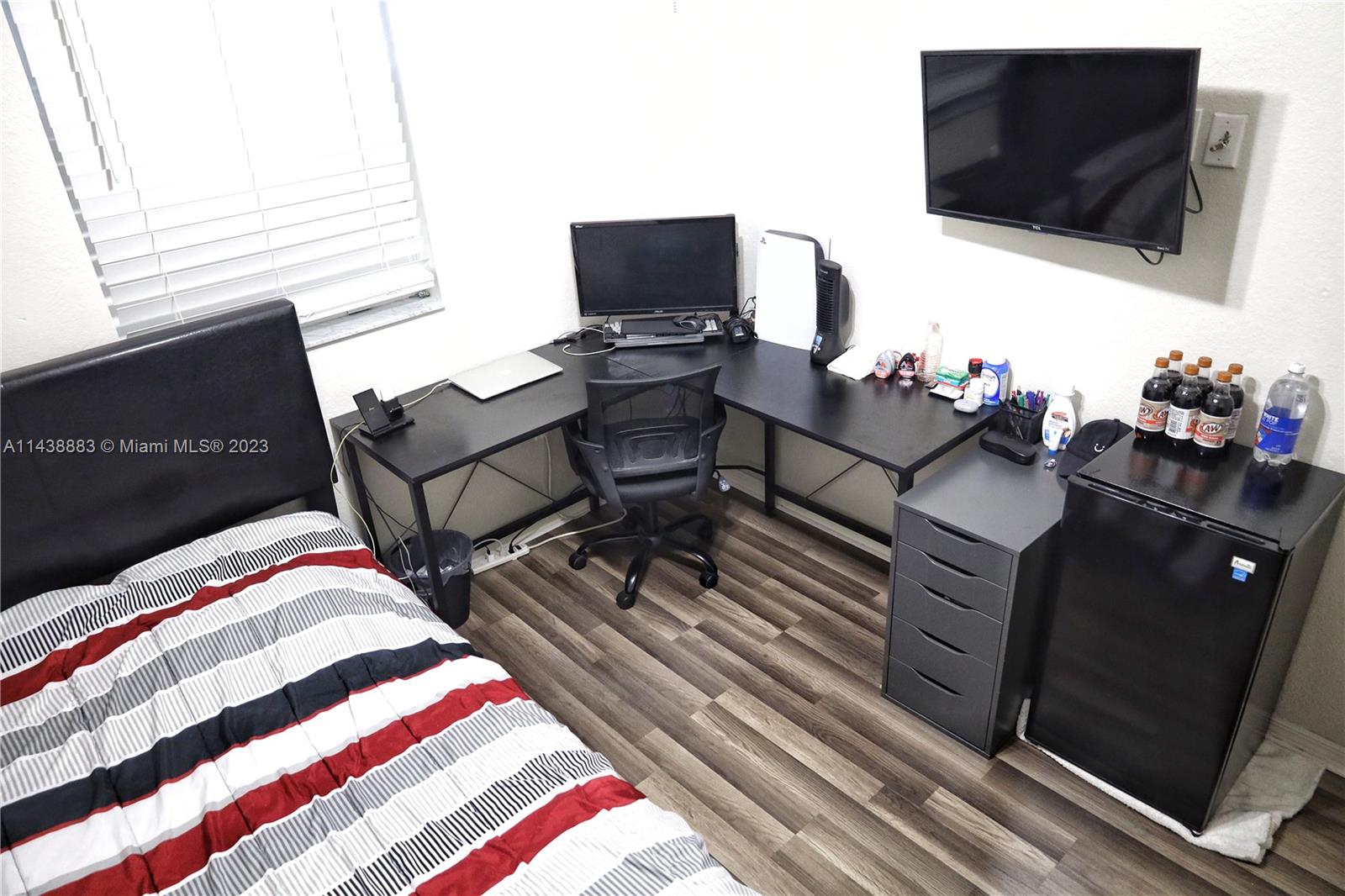 301 Southwest 87th Path Miami, FL 33174 - Photo 20 of 22 a bedroom with a bed and flat screen tv