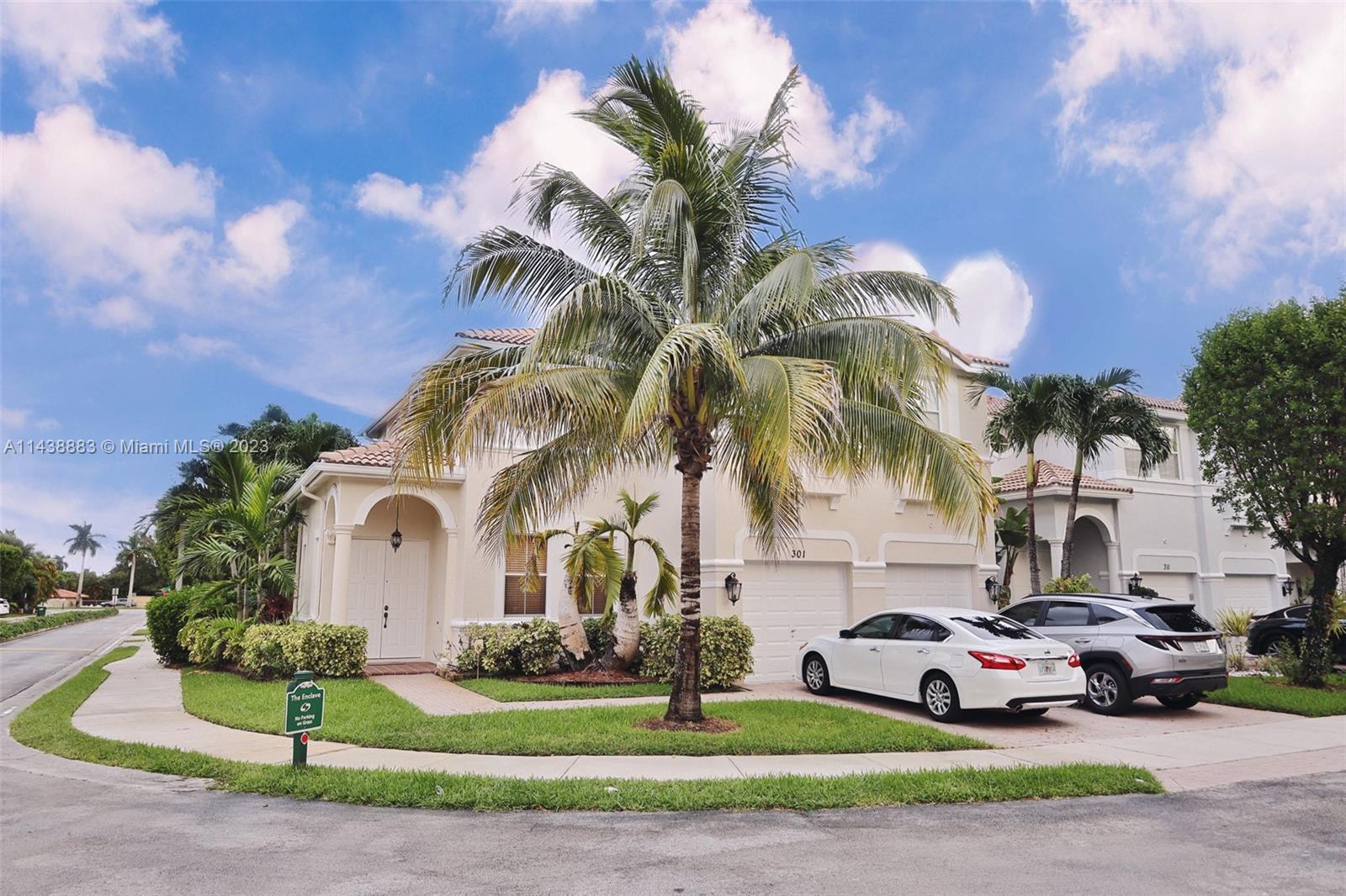 301 Southwest 87th Path Miami, FL 33174 - Photo 2 of 22 a view of a white house with a yard and entertaining space