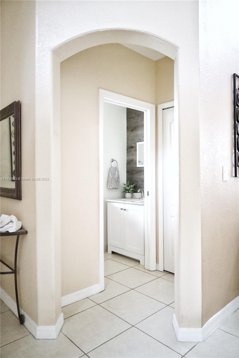 301 Southwest 87th Path Miami, FL 33174 - Photo 5 of 22 a bathroom with a sink and a mirror