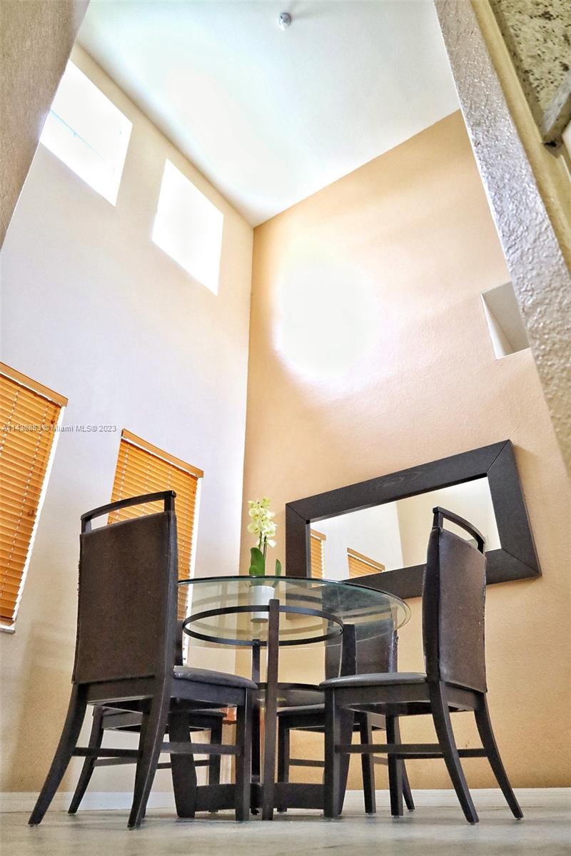 301 Southwest 87th Path Miami, FL 33174 - Photo 7 of 22 a balcony view with chairs and wooden floor