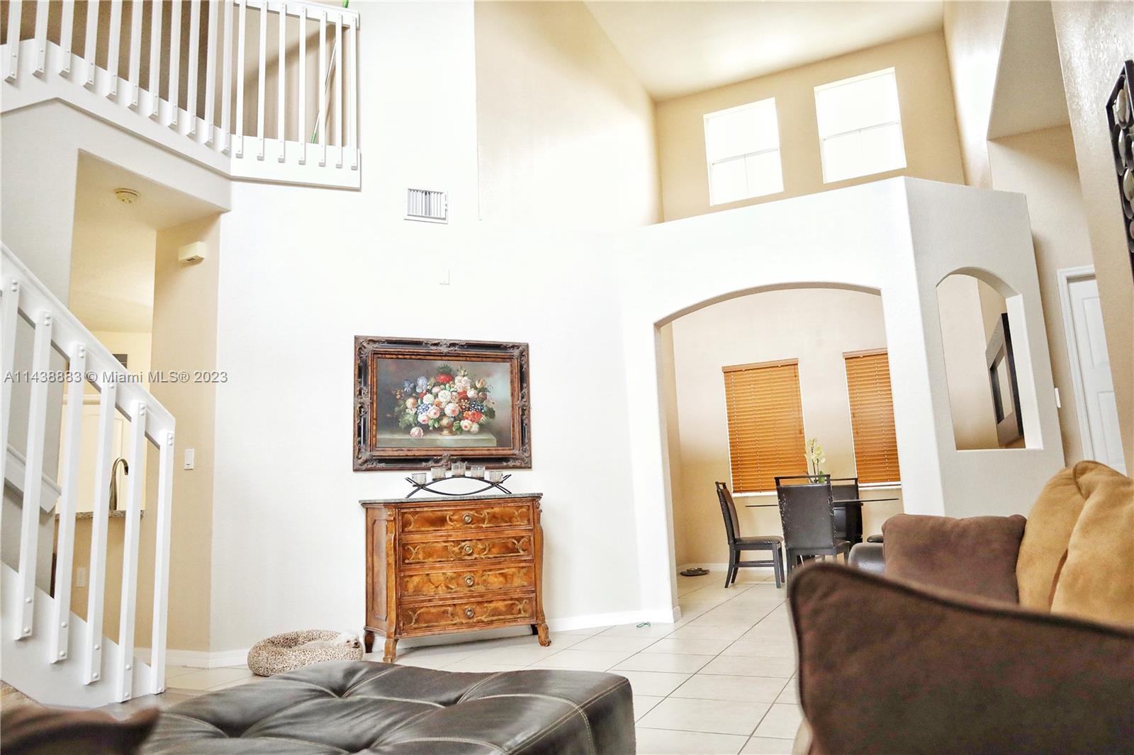 301 Southwest 87th Path Miami, FL 33174 - Photo 8 of 22 a living room with furniture and a large window