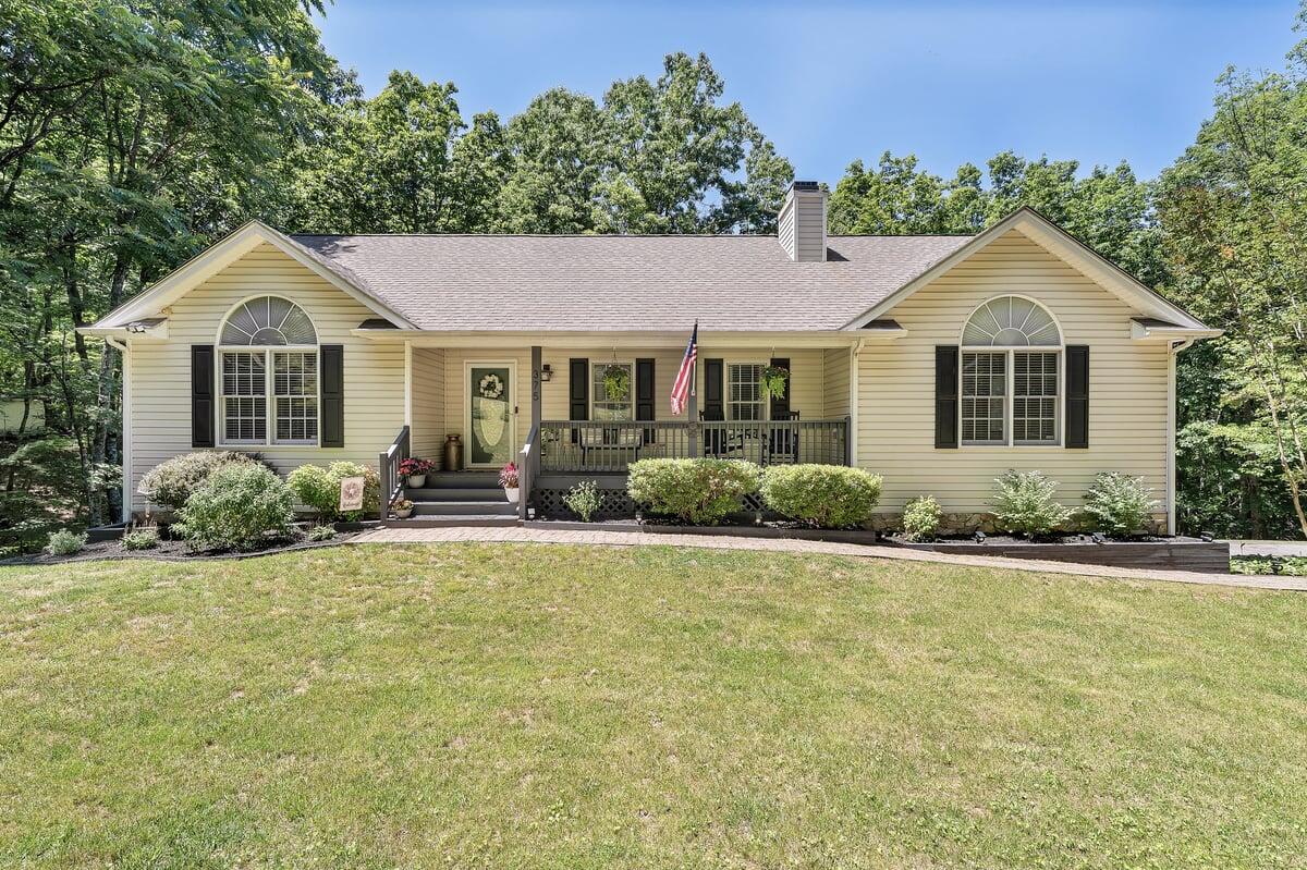 a front view of a house with a yard