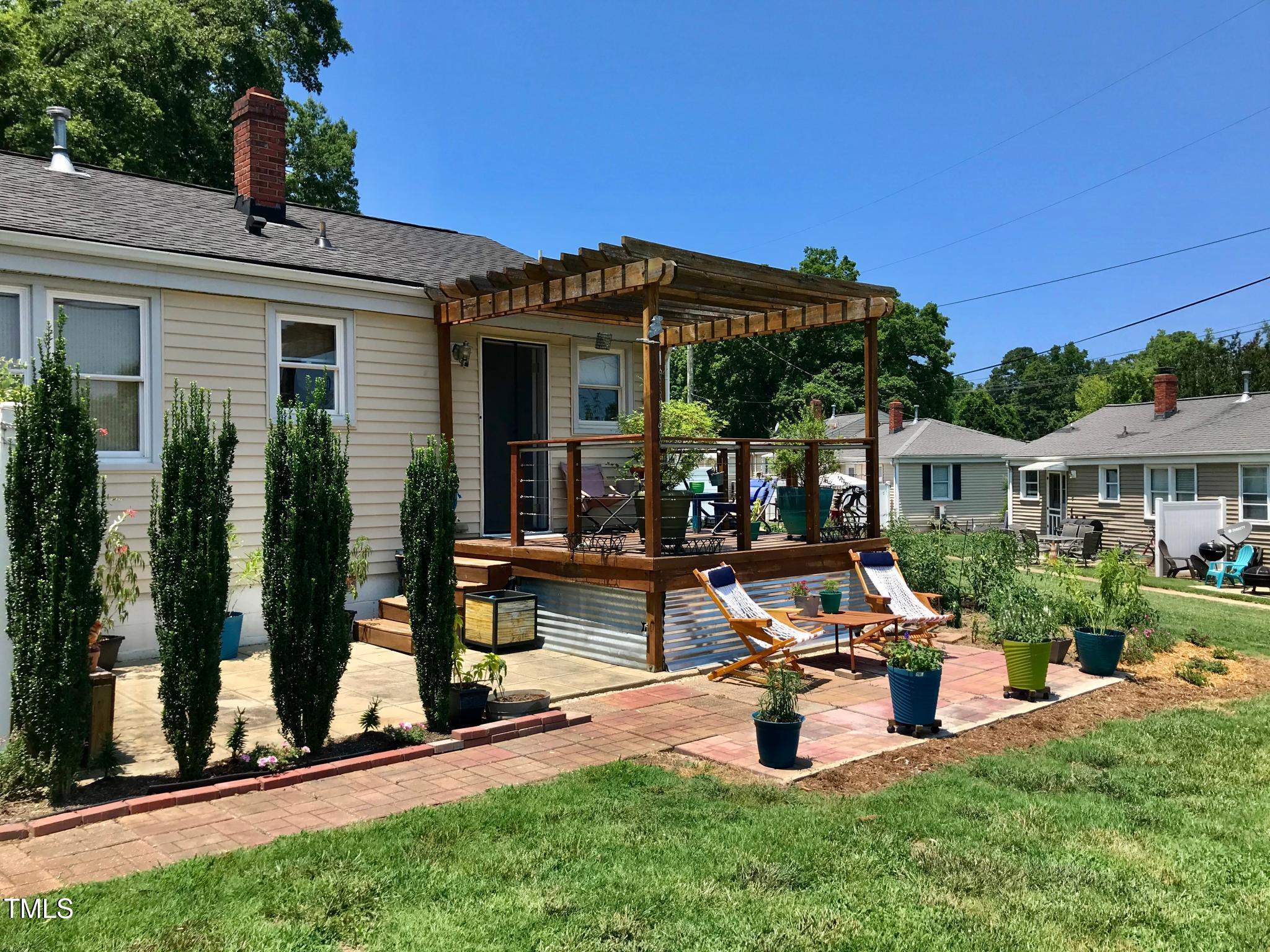 2340 Bernard Street Raleigh, NC 27608 - Photo 2 of 14 a view of a house with backyard porch and sitting area