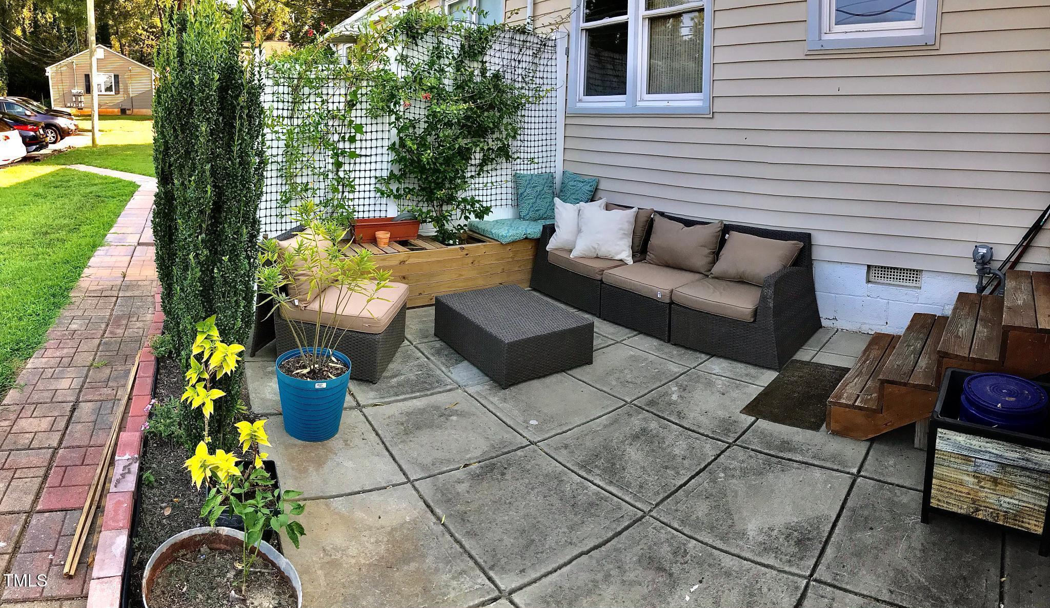 2340 Bernard Street Raleigh, NC 27608 - Photo 3 of 14 a outdoor living space with furniture and a potted plant