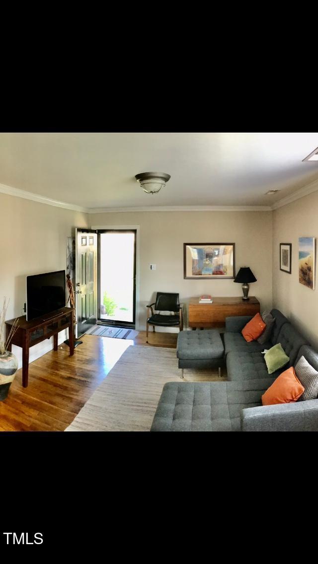 2340 Bernard Street Raleigh, NC 27608 - Photo 5 of 14 a living room with furniture and a flat screen tv