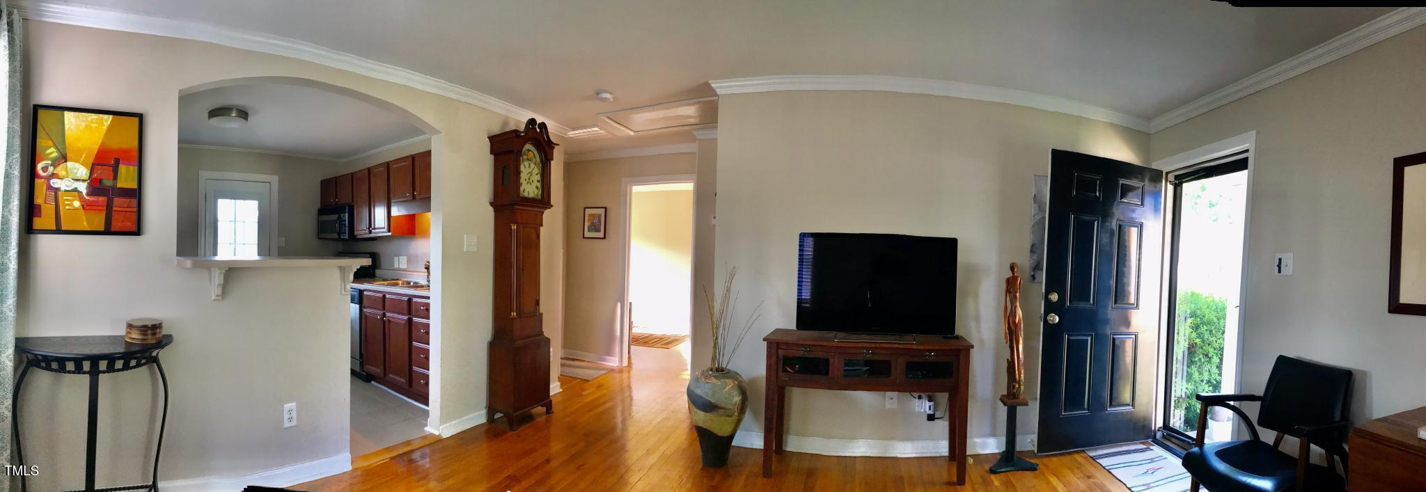 2340 Bernard Street Raleigh, NC 27608 - Photo 6 of 14 a view of a livingroom with furniture and a flat screen tv