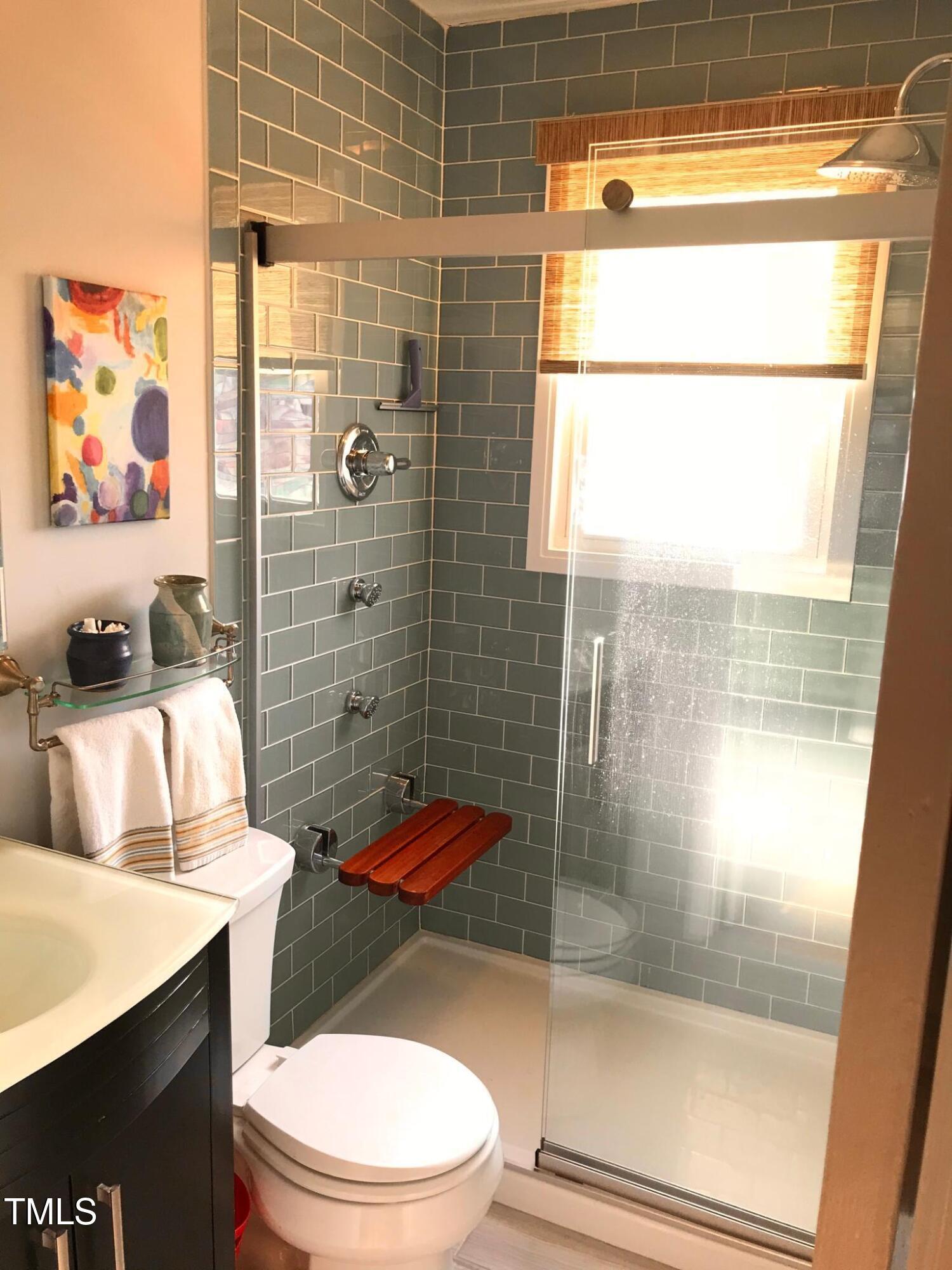 2340 Bernard Street Raleigh, NC 27608 - Photo 8 of 14 a bathroom with a toilet and a shower