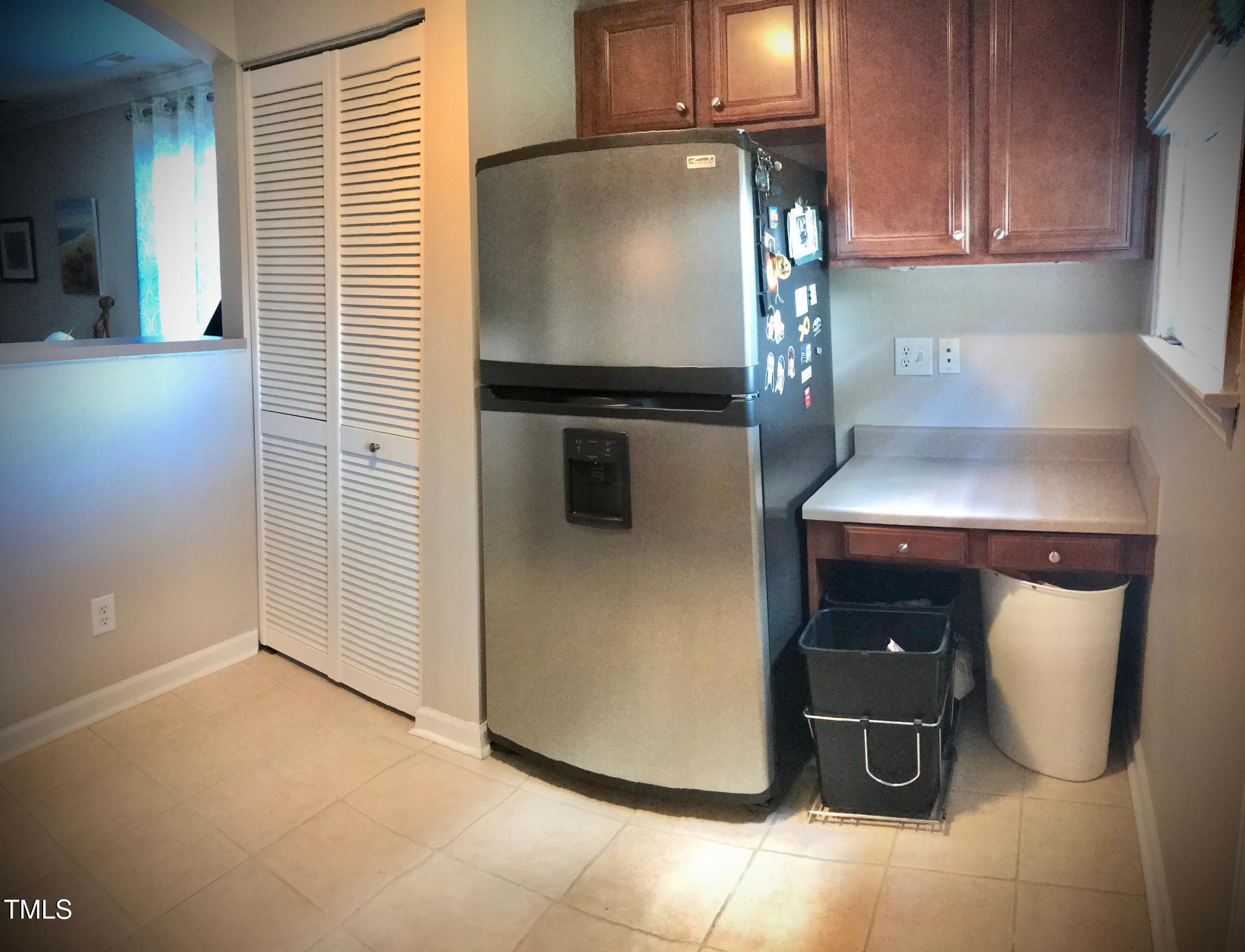 2340 Bernard Street Raleigh, NC 27608 - Photo 9 of 14 a kitchen with a sink and a refrigerator