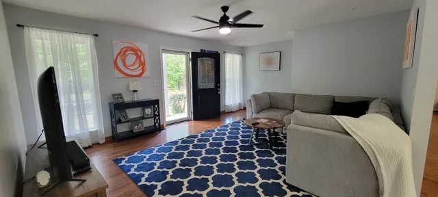 a bedroom with a bed and a fireplace