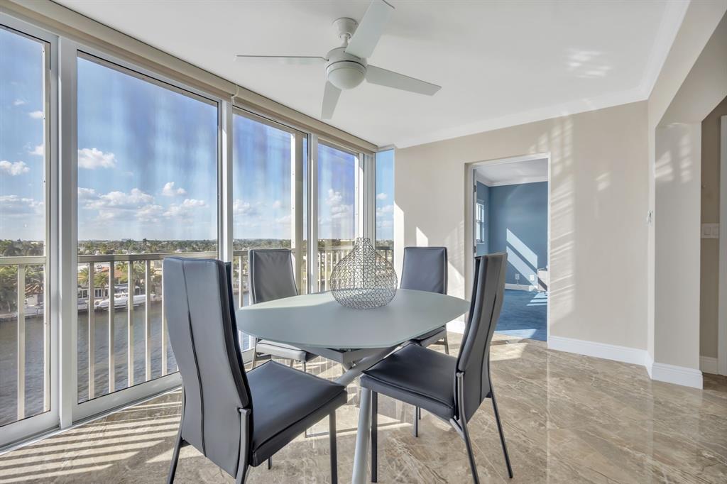 615 North Riverside Drive, Unit 702 Pompano Beach, FL 33062 - Photo 18 of 38 a view of a dining room with furniture window and outside view