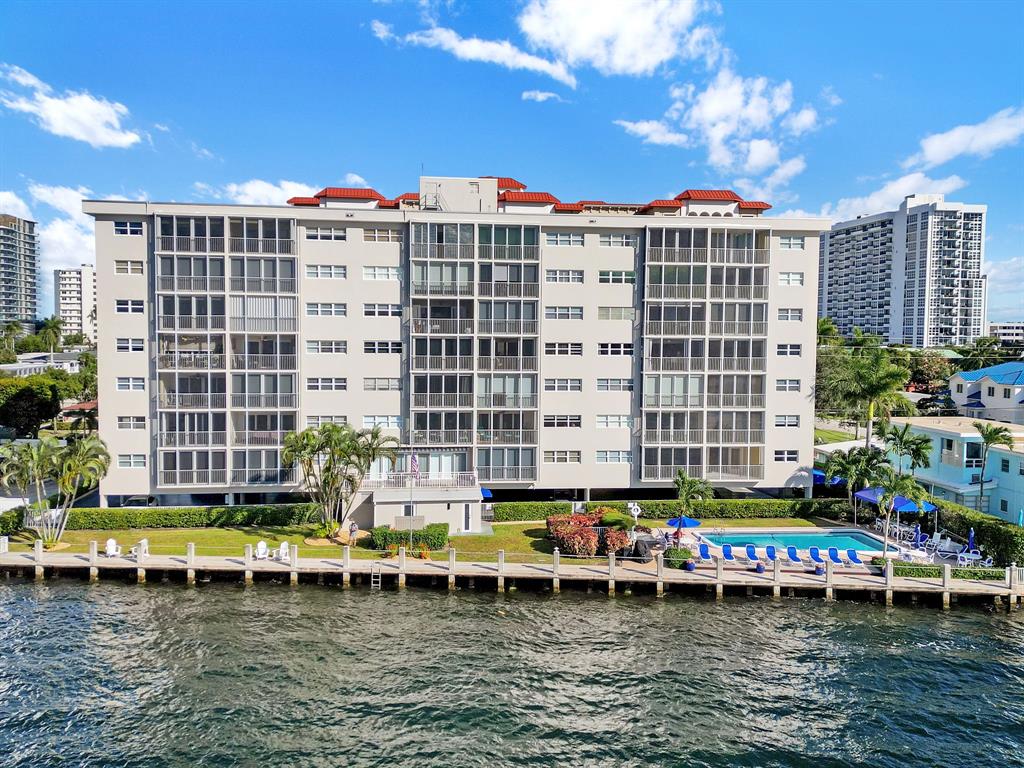 615 North Riverside Drive, Unit 702 Pompano Beach, FL 33062 - Photo 31 of 38 a view of swimming pool with outdoor seating and a patio