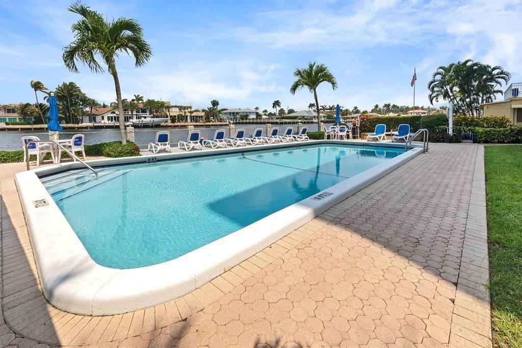 615 North Riverside Drive, Unit 702 Pompano Beach, FL 33062 - Photo 38 of 38 a view of swimming pool with a lounge chair