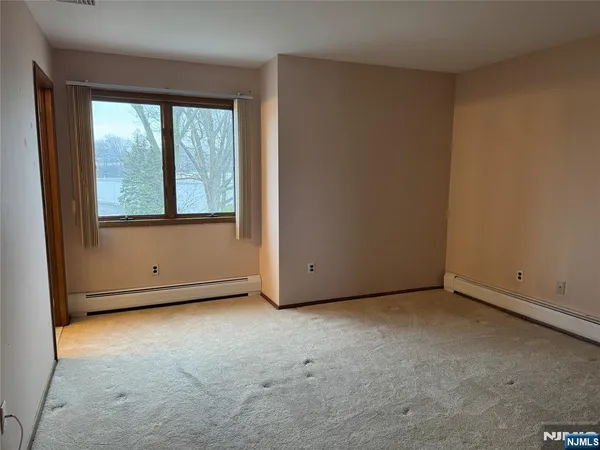 a bathroom with a toilet a sink and shower