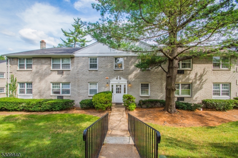 135 South Maple Avenue Ridgewood, NJ 07450 - Photo 3 of 7 a front view of a house with yard and green space