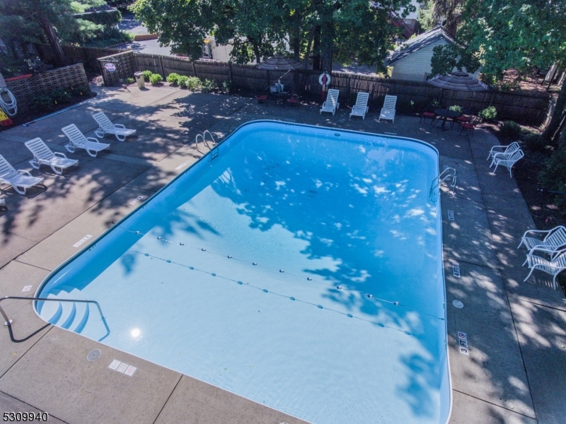 135 South Maple Avenue Ridgewood, NJ 07450 - Photo 5 of 7 a view of swimming pool with lawn chairs and plants