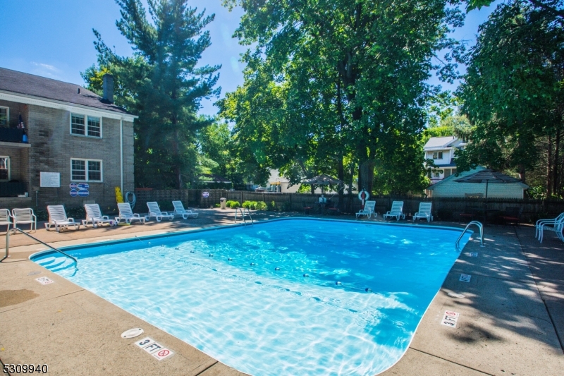 135 South Maple Avenue Ridgewood, NJ 07450 - Photo 6 of 7 a view of a swimming pool with sitting area and furniture