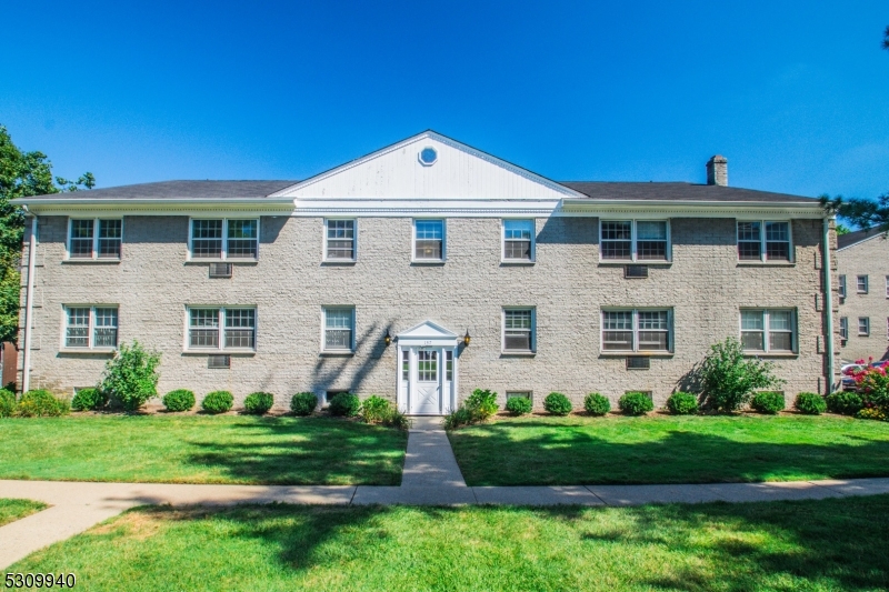 135 South Maple Avenue Ridgewood, NJ 07450 - Photo 7 of 7 a front view of a house with a garden