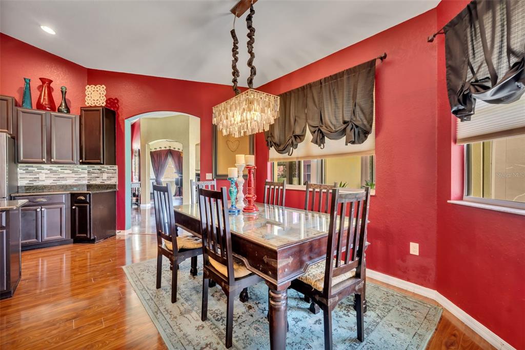 4946 Northeast 124th Road Oxford, FL 34484 - Photo 15 of 69 a view of a dining room with furniture window and wooden floor