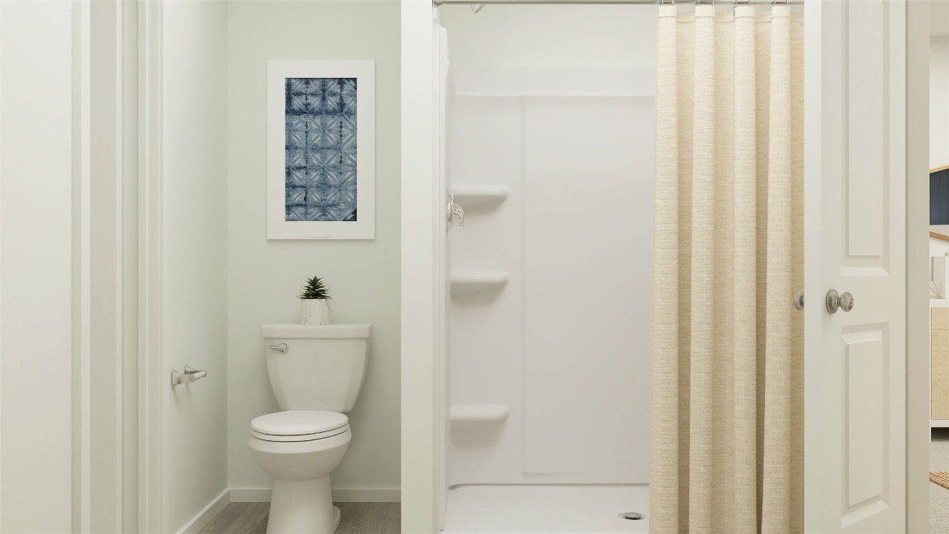 431 Silvercloud Drive Lockhart, TX 78644 - Photo 36 of 39 a white toilet sitting next to a bathroom sink