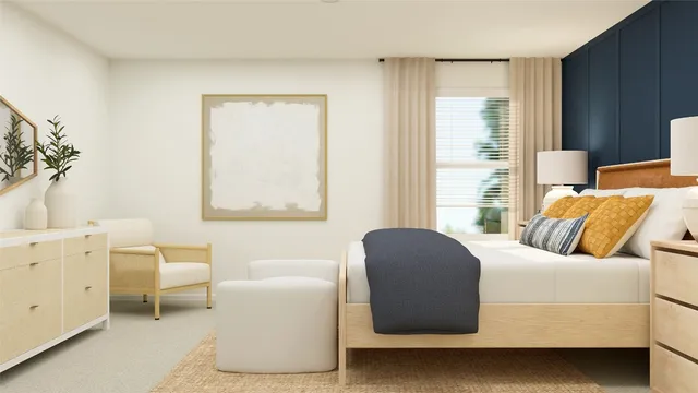 a bedroom with furniture and a window
