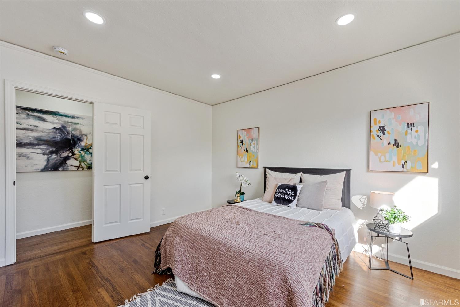 5955 Hayes Street Oakland, CA 94621 - Photo 11 of 20 a bedroom with a bed and a painting on the wall
