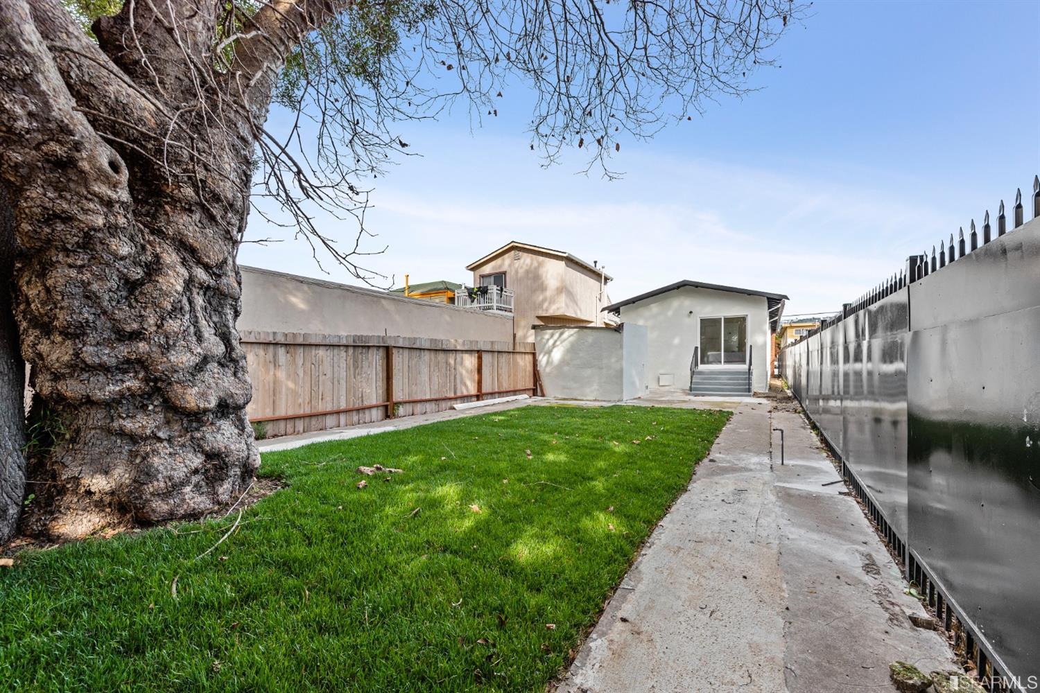 5955 Hayes Street Oakland, CA 94621 - Photo 20 of 20 a view of a yard in front of a house with a yard