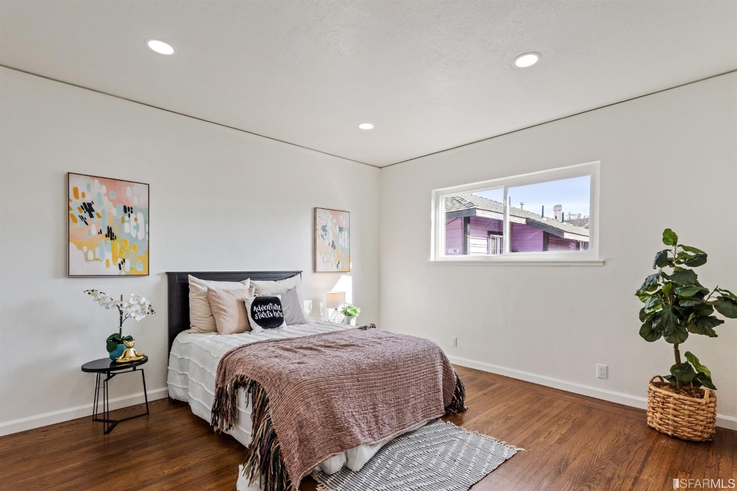 5955 Hayes Street Oakland, CA 94621 - Photo 10 of 20 a bedroom with bed and wooden floor