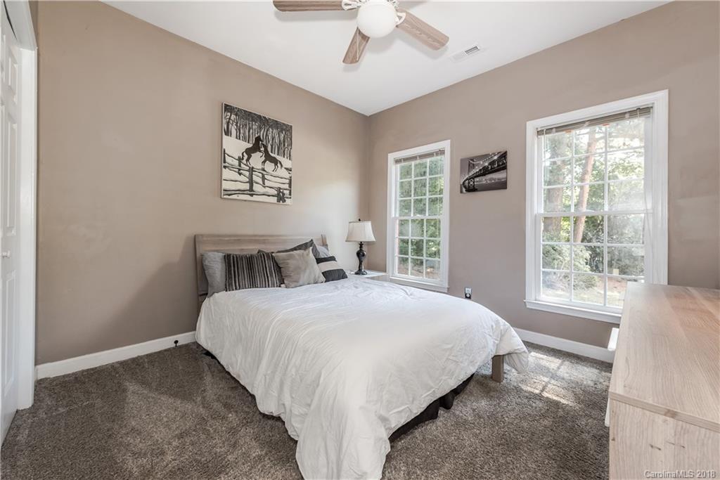 701 Monticello Drive Fort Mill, SC 29708 - Photo 14 of 21 a bedroom with a large bed and a window