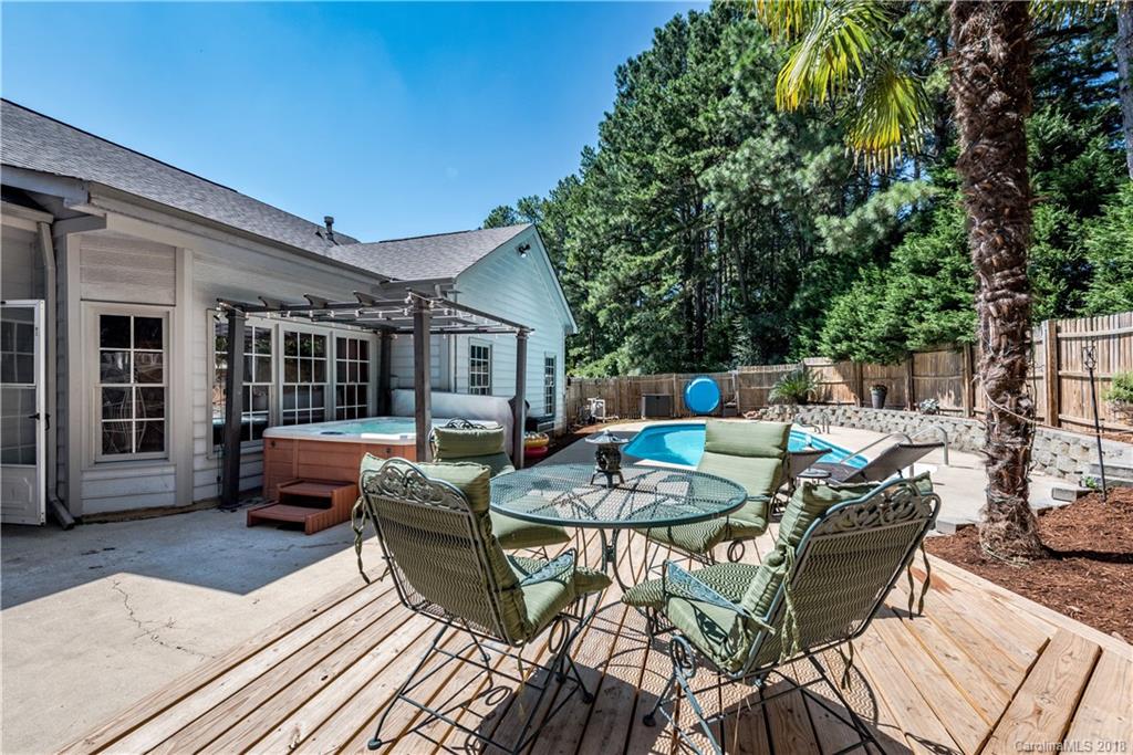 701 Monticello Drive Fort Mill, SC 29708 - Photo 20 of 21 a view of a patio with couches table and chairs and potted plants