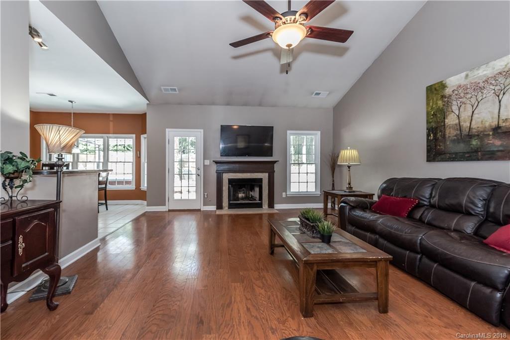 701 Monticello Drive Fort Mill, SC 29708 - Photo 6 of 21 a living room with furniture fireplace and flat screen tv