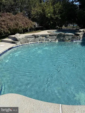 a view of grassy field with benches