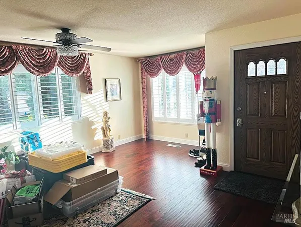 a bedroom with furniture and a window