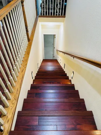 an entryway door with a hallway in the background