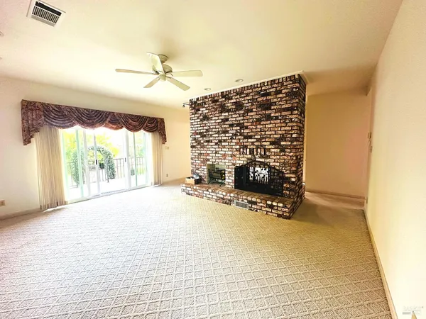 a hallway with sink two mirror and a window
