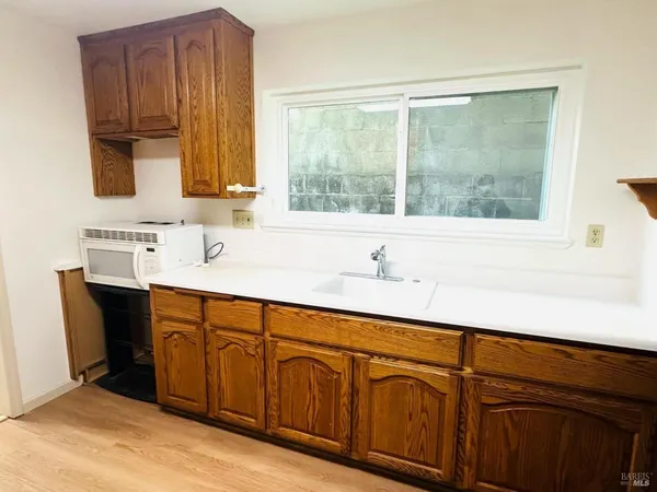 a view of a backyard with sitting area