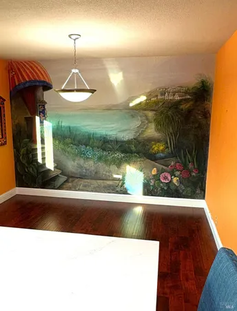 a view of entryway with wooden floor