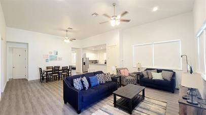 1709 Sycamore Street, Unit 1 Commerce, TX 75428 - Photo 3 of 17 a living room with furniture and wooden floor