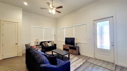 1709 Sycamore Street, Unit 1 Commerce, TX 75428 - Photo 4 of 17 a living room with furniture and a window