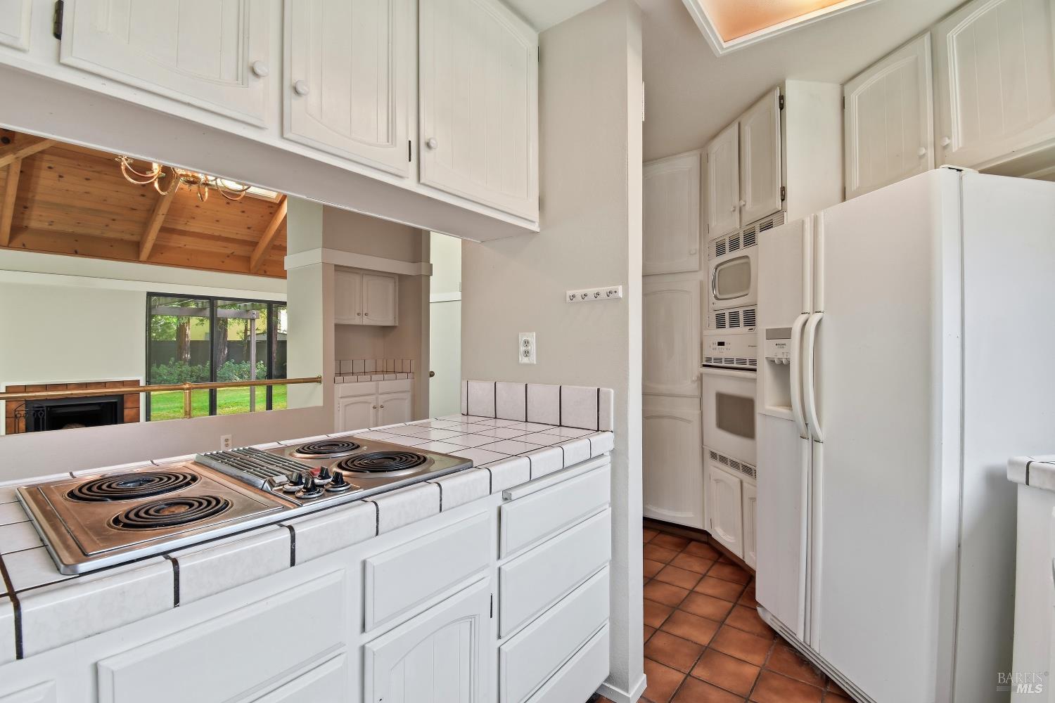 1320 North Street, Unit 7 Santa Rosa, CA 95404 - Photo 14 of 28 a kitchen with cabinets and a stove